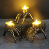 Halloween skeleton LED candle lantern with eerie orange glow