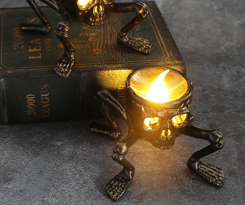 Halloween skeleton LED candle lantern with eerie orange glow