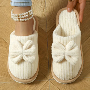 Bowknot winter slippers with plush lining for cozy indoor wear