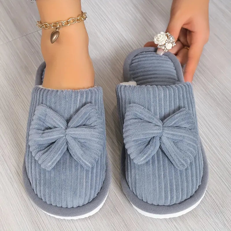 Bowknot winter slippers with plush lining for cozy indoor wear